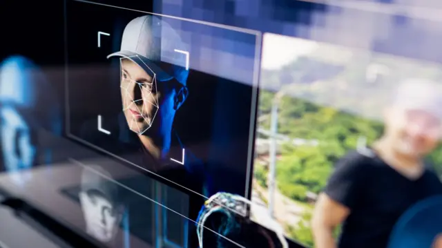 A stock image mocked up to represent the process of creating deepfake images using pictures of real people