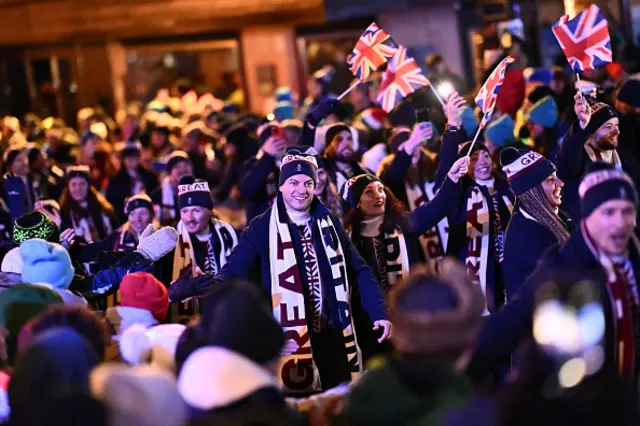 Members of Britain's delegation parade during the opening ceremony of the Milano Cortina