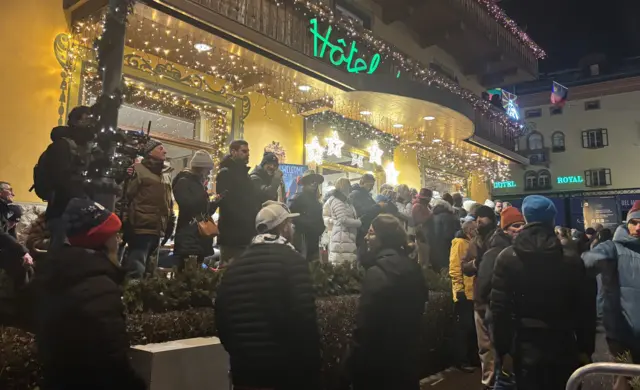 Fans outside hotel