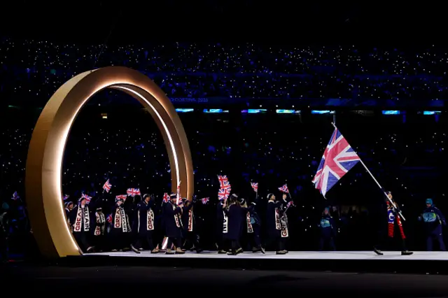 Flagbearer Lilah Fear of Team Great Britain enters with the team into the stadium