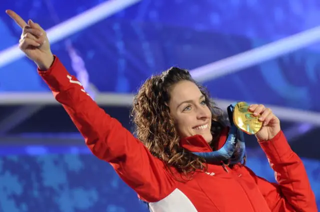Britain's Amy Williams finishes the final heat to win gold in the women's Skeleton final