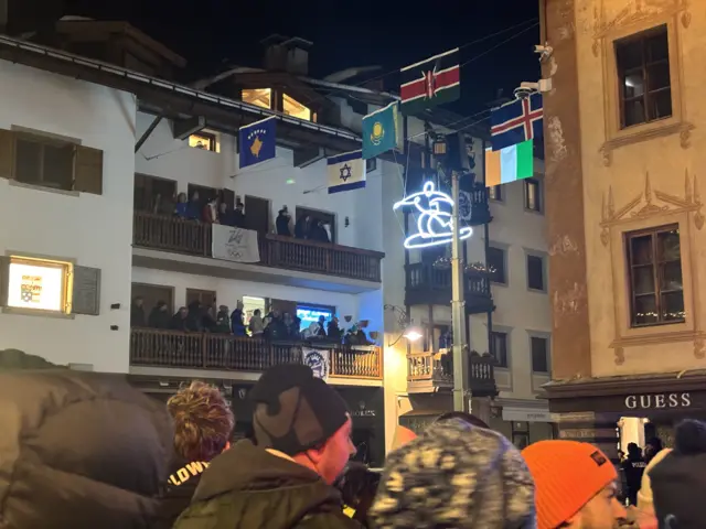 Fans gather on balconies to watch opening ceremony