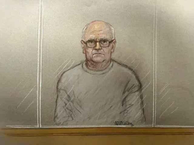 Court sketch of Steve Wright, who looks glum and is wearing a grey jumper