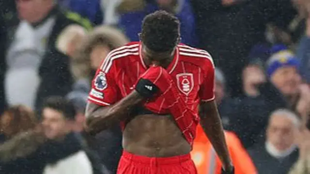Sangare wipes his shirt on his face