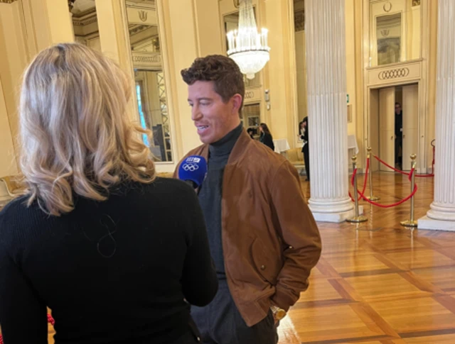 Former American snowboarder Shaun White speaks to the media