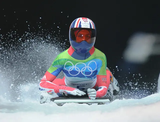 Britain's Amy Williams finishes the final heat to win gold in the women's Skeleton final