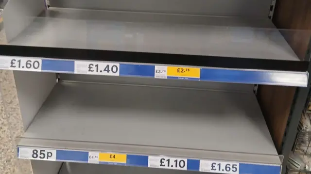 Empty shelves in a supermarket