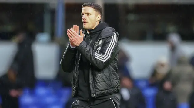 Leicester interim head coach Andy King applauding supporters after losing at Birmingham