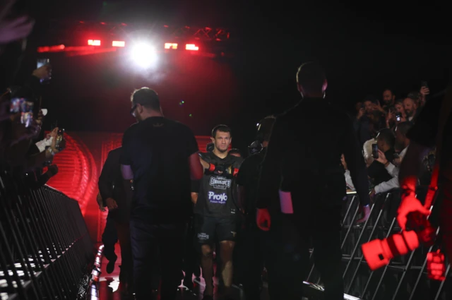 Usman Nurmagomedov walks to the cage