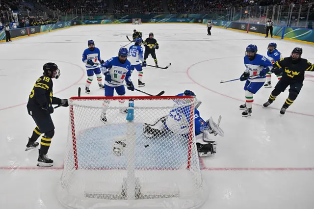 : Defender #09 Jessica Adolfsson #09 of Team Sweden (R) scores the 1-0 goal during the women's preliminary round group B Ice Hockey match