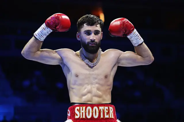 Hassan Ishaq celebrates in the ring