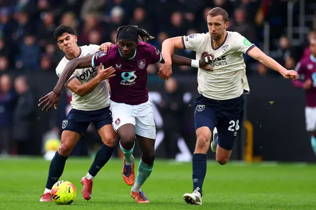 Tomas Soucek and Mateus Fernandes battle Lesley Ugochukwu for the ball