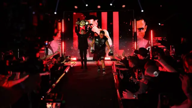 Nick Ball walks to the ring