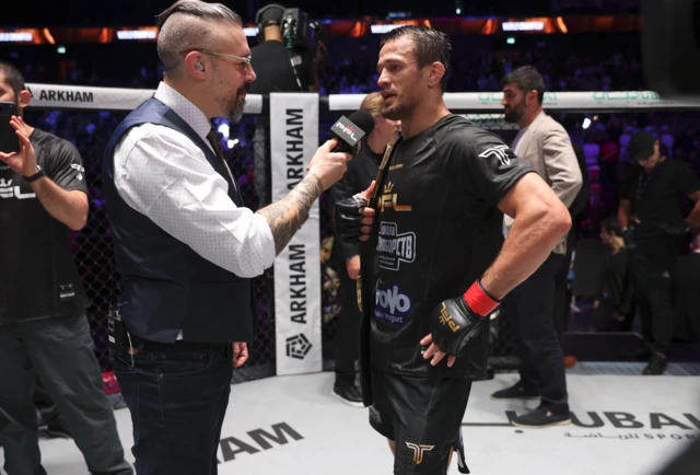 Dan Hardy speaks to Usman Nurmagomedov in the cage