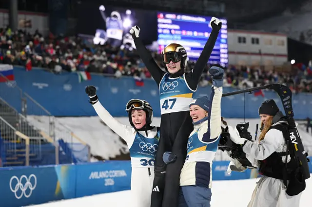 Norway's Eirin Maria Kvandal (L), gold medallist Norway's Anna Odine Stroem and Norway's Silje Opseth celebrate