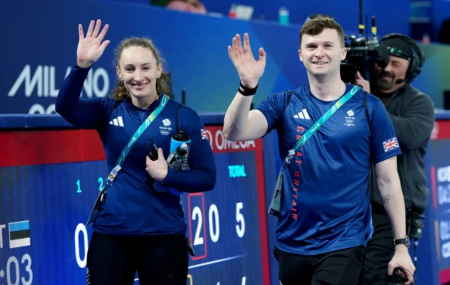 Great Britain's Jennifer Dodds and Bruce Mouat leave the ring after defeating the USA's Cory Thiesse and Korey Dropkin