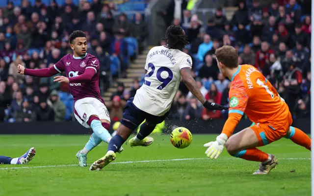 Marcus Edwards' shot is saved by Mads Hermansen