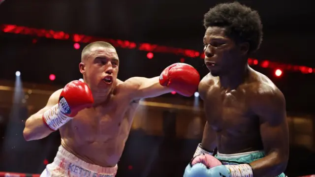 Nick Ball punches Raymond Ford