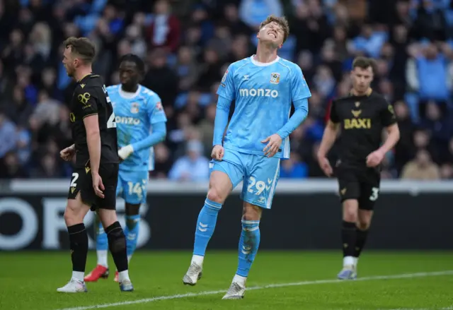 Coventry City's Victor Torp (centre) reacts following a missed opportunity