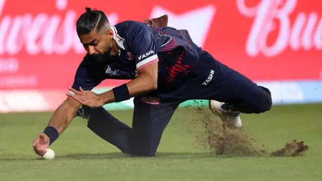 Ali Khan of the United States fields the ball