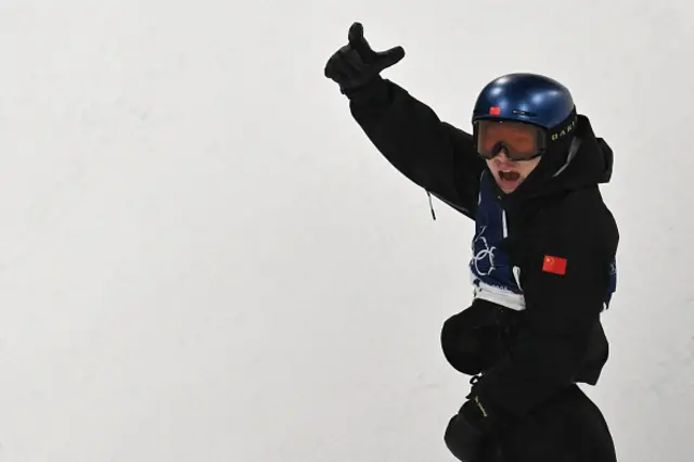 China's Su Yiming reacts in the snowboard men's big air