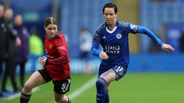 Ashleigh Neville and Jess Park pursue the ball