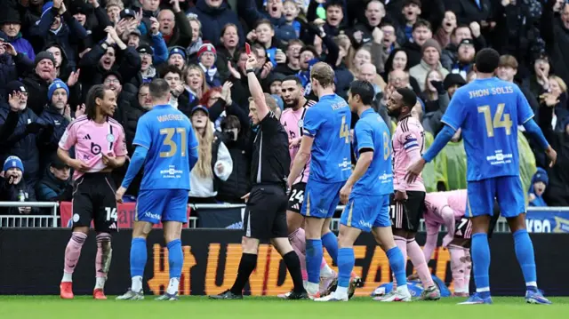 Leicester's Bobby De Cordova-Reid is shown a red card