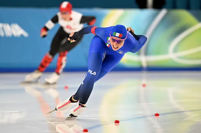 Italy's Francesca Lollobrigida (R) and Canada's Valerie Maltais compete in the speed skating