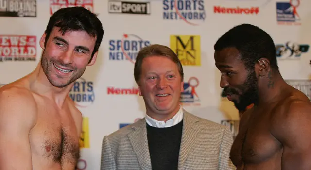 Frank Warren smiles and stands between Joe Calzaghe and Jeff Lacy