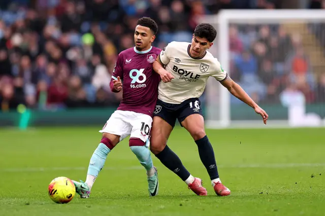 Marcus Edwards and Mateus Fernandes battle for the ball