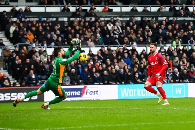 Derby County Goalkeeper Josh Vickers saves a close range shot from Wes Burns of Ipswich Town