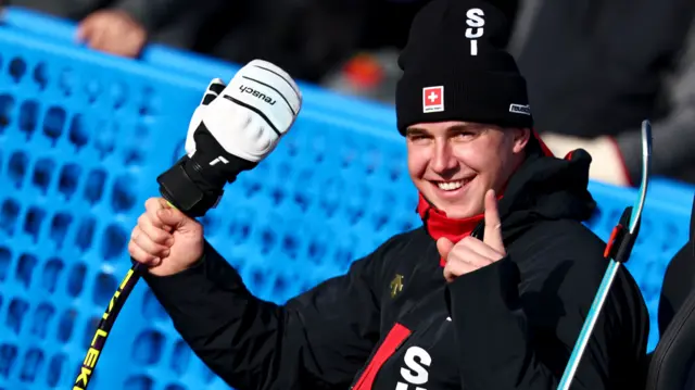 Franjo von Allmen of Switzerland reacts in the finish area after his run in the Men's Downhill of the Alpine Skiing competition, at the Milano Cortina 2026 Winter Olympic Games