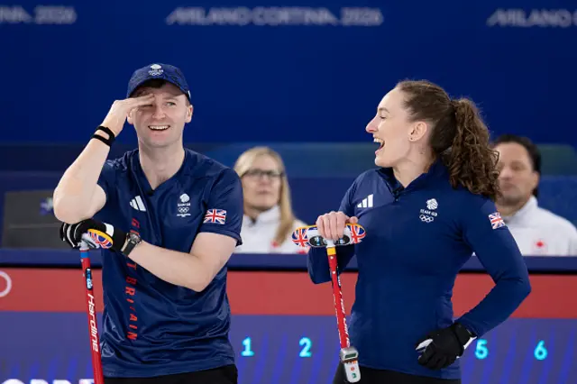 Britain's Bruce Mouat (L) and Britain's Jennifer Dodds (R) react