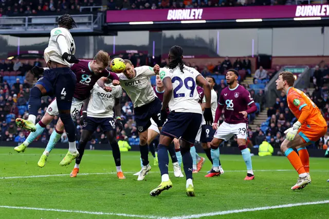 Zian Flemming and Tomas Soucek head the ball