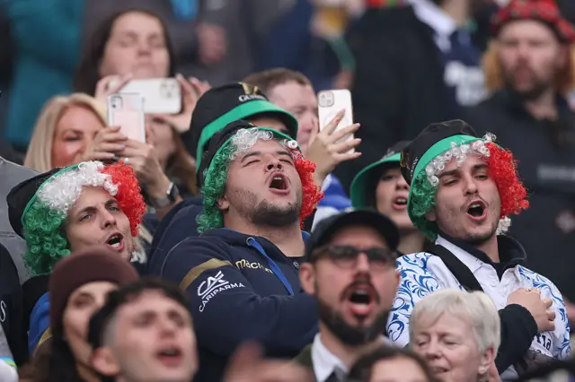 Italian fans sing their national anthem