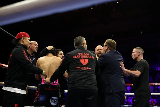 Brandon Figueroa shielded by his team