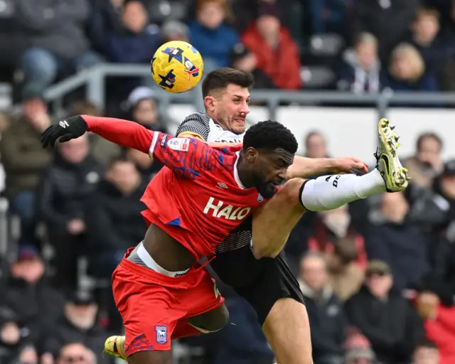 Ipswich Town's Cedric Kipre (left) and Derby County's Danny Batth battle for the ball