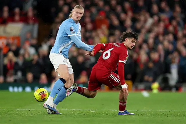 Erling Haaland of Manchester City and Milos Kerkez of Liverpool battle for possession during the Premier League match between Liverpool and Manchester City at Anfield on February 08, 2026 in Liverpool, England.