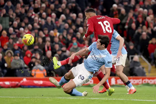 Cody Gakpo of Liverpool is challenged by Abdukodir Khusanov of Manchester City during the Premier League match between Liverpool and Manchester City at Anfield on February 08, 2026 in Liverpool, England.