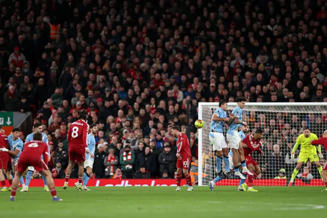Dominik Szoboszlai of Liverpool scores his team's first goal from a free kick during the Premier League match between Liverpool and Manchester City at Anfield on February 08, 2026 in Liverpool, England.