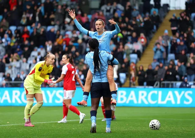 Caparij celebrates with Shaw after scoring in the reverse fixture