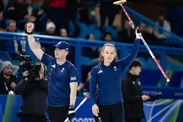 Britain's Bruce Mouat (L) and Britain's Jennifer Dodds (R) react in the curling mixed doubles