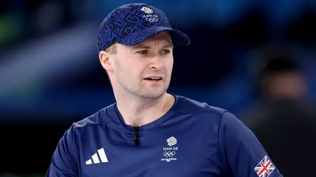 Bruce Mouat of Team Great Britain competes with Jennifer Dodds