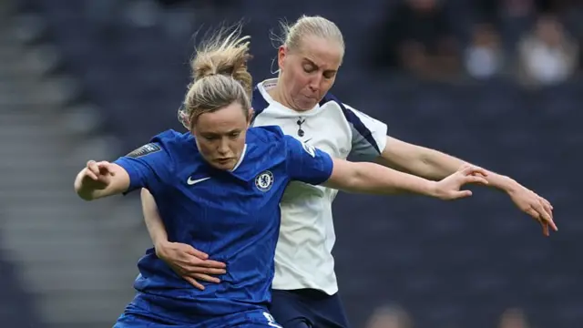 Erin Cuthbert of Chelsea is challenged by Eveliina Summanen