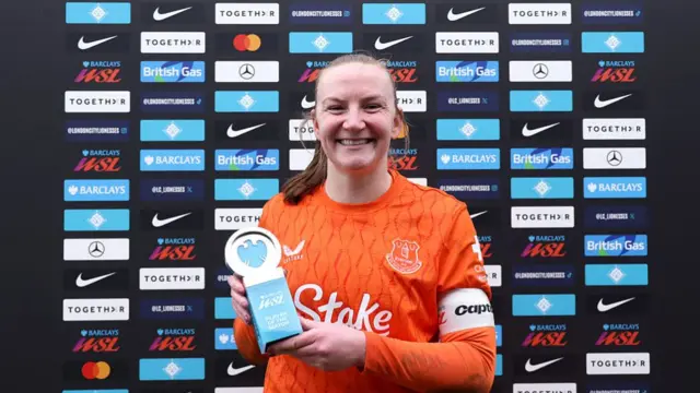 Courtney Brosnan poses with her award
