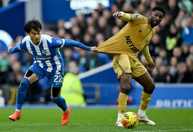 Kaoru Mitoma of Brighton & Hove Albion challenges Jefferson Lerma of Crystal Palace during the Premier League match between Brighton & Hove Albion and Crystal Palace at Amex Stadium on February 08, 2026 in Brighton, England.