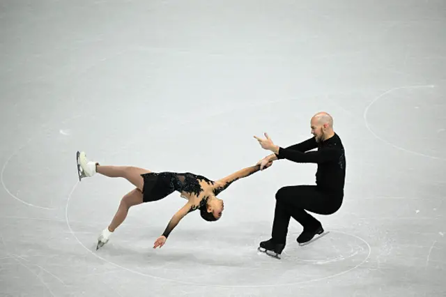USA's Ellie Kam (L) and USA's Danny O'Shea (R) compete in the figure skating pair free skating
