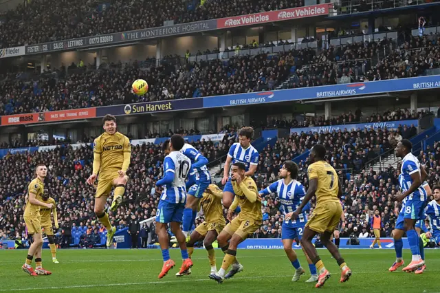 Crystal Palace's Norwegian striker #22 Jorgen Strand Larsen wins a header during the English Premier League football match between Brighton and Hove Albion and Crystal Palace at the American Express Community Stadium in Brighton, southern England on February 8, 2026.