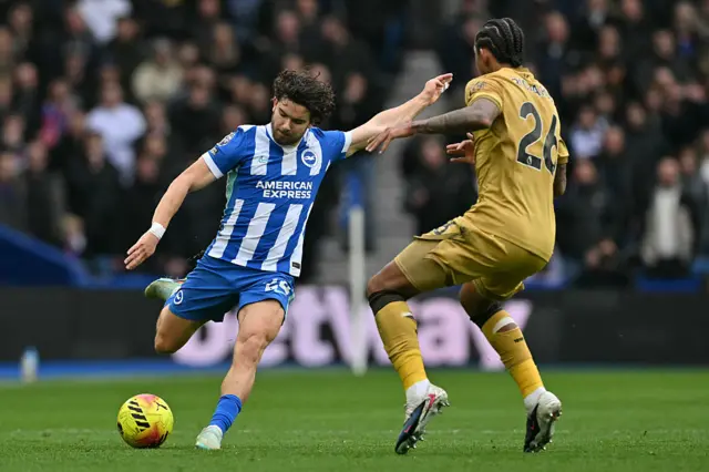 Brighton's Turkish defender #24 Ferdi Kadioglu (L) vies with Crystal Palace's US defender #26 Chris Richards (R) during the English Premier League football match between Brighton and Hove Albion and Crystal Palace at the American Express Community Stadium in Brighton, southern England on February 8, 2026.
