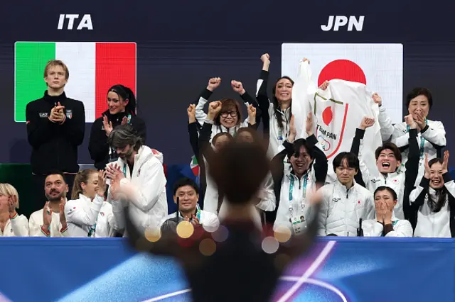 Team Japan shows their support after Shun Sato
